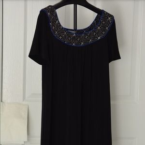 Women’s knitted dress with fancy trims. (Sample)